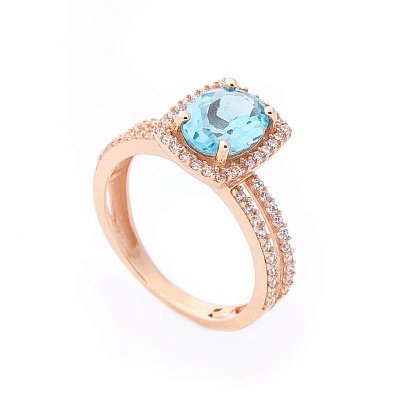 Золота каблучка з блакитним топазом і фіанітами к04647