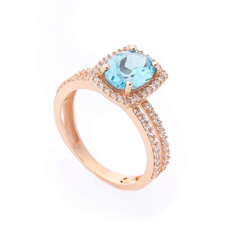 Золота каблучка з блакитним топазом і фіанітами к04647 від ювелірного магазину Онікс