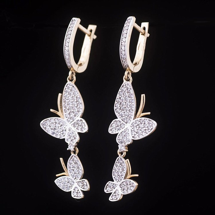 Золоті сережки "Метелики" з фіанітами с03550 від ювелірного магазину Онікс