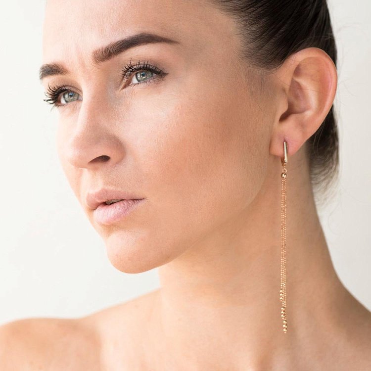 Золоті сережки на ланцюжку с05606 від ювелірного магазину Онікс