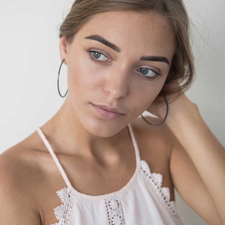 Золоті сережки "Кільця" з чорними фіанітами TNSCIONECCB0b від ювелірного магазину Онікс - 4