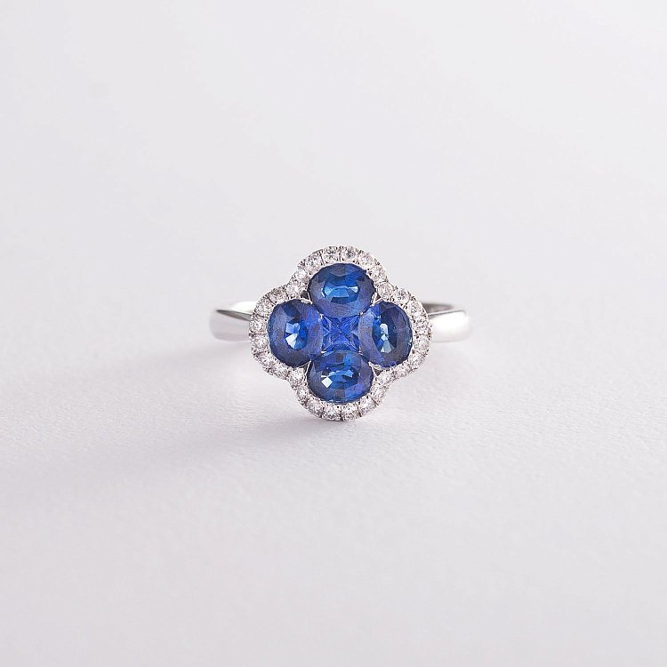 Золота каблучка з сапфірами і діамантами R01555mi Золота каблучка з сапфірами і діамантами R01555mi від ювелірного магазину Онікс