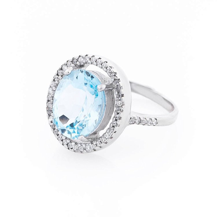 Срібний перстень з блакитним топазом і фіанітами 111517 від ювелірного магазину Онікс - 1
