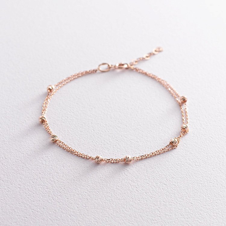 Подвійний браслет "Кульки" в червоному золоті б04573 від ювелірного магазину Онікс