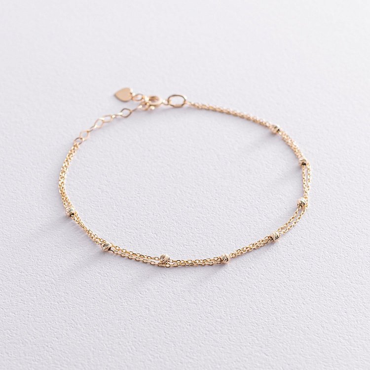 Двойной браслет "Шарики" в желтом золоте б04706 от ювелирного магазина Оникс