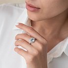 Серебряное кольцо с голубым топазом и фианитами 111449 от ювелирного магазина Оникс - 1