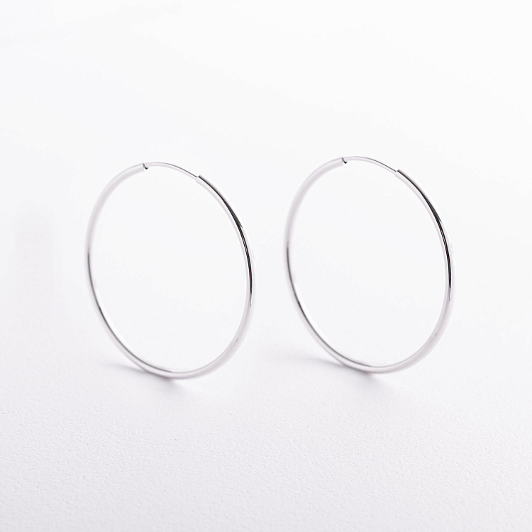 Сережки - кільця в білому золоті с09689 від ювелірного магазину Онікс