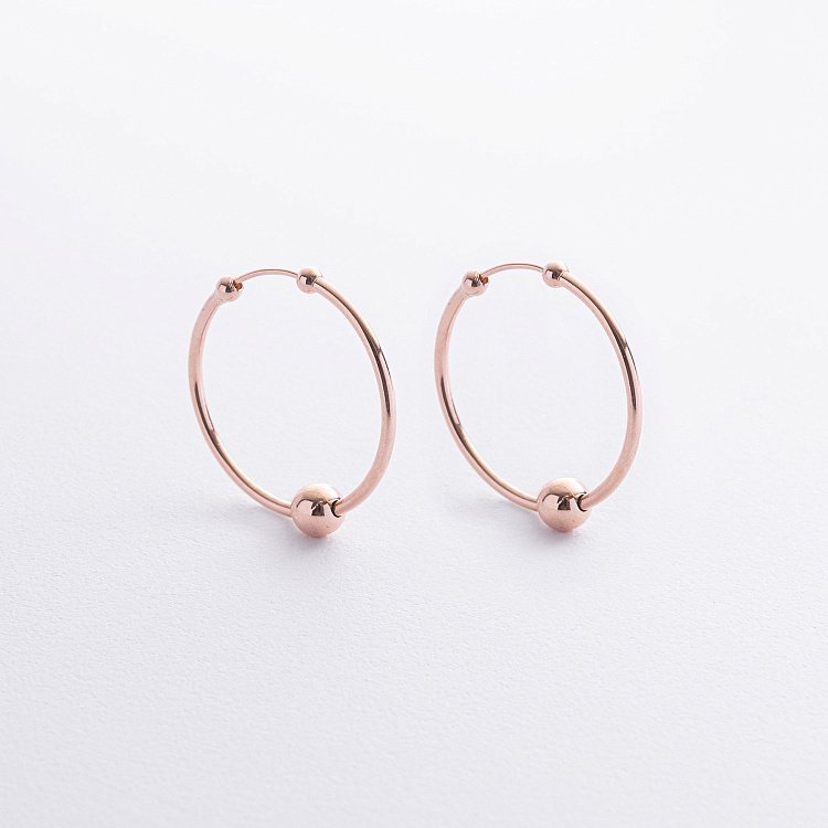 Сережки - кільця Гармонія в червоному золоті с09219 від ювелірного магазину Онікс