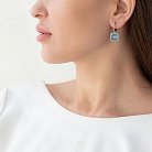Золоті сережки з блакитним топазом і діамантами C01111E от ювелирного магазина Оникс - 1