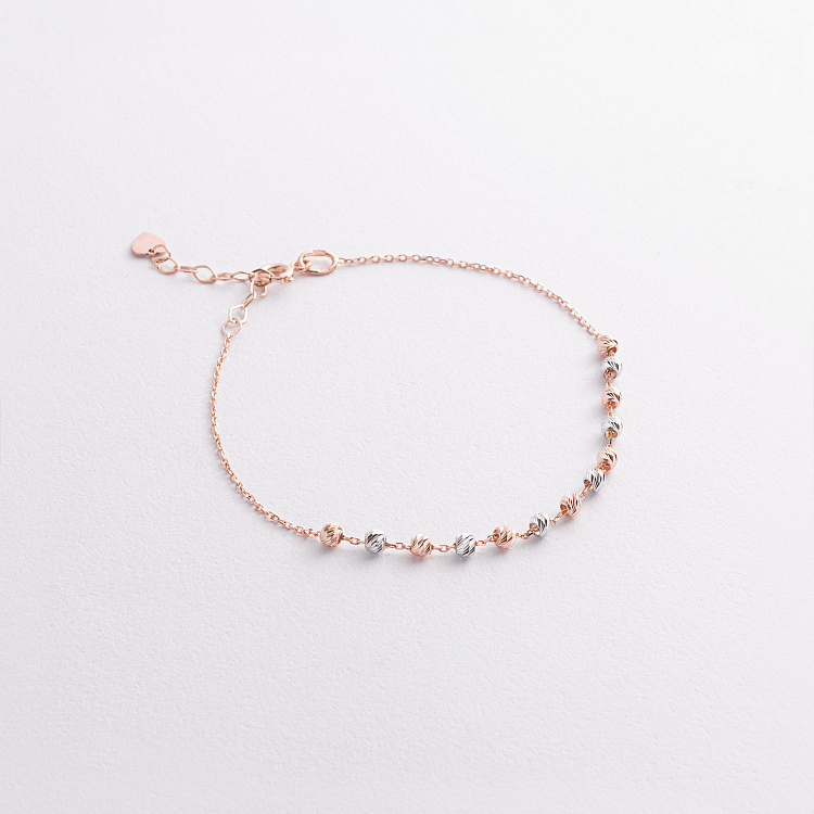 Браслет "Кульки" (червоне, біле золото) б05647 від ювелірного магазину Онікс