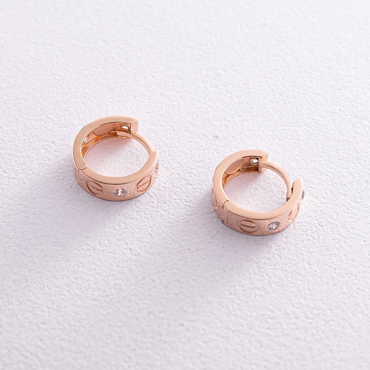 Золоті сережки - кільця "Love" з фіанітами с08143 від ювелірного магазину Онікс - 1