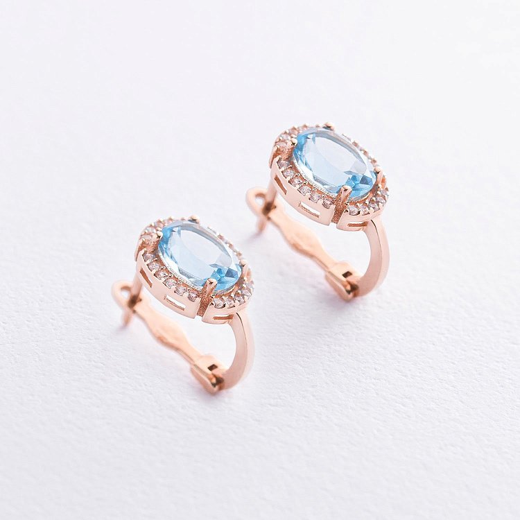 Золоті сережки з топазом і фіанітами с04190 від ювелірного магазину Онікс