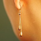 Золоті жіночі сережки довгі з крапельками с02809 от ювелирного магазина Оникс - 2