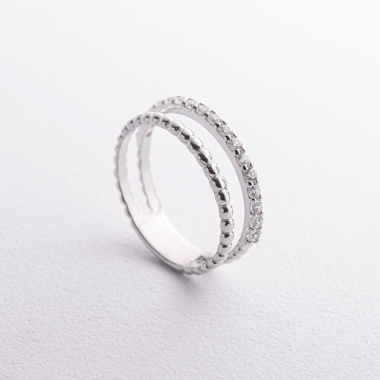 Подвійна срібна каблучка з фіанітами 901-01612 Подвійна срібна каблучка з фіанітами 901-01612 від ювелірного магазину Онікс