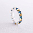 Серебряное кольцо с дорожкой голубых и желтых камней 112664 от ювелирного магазина Оникс