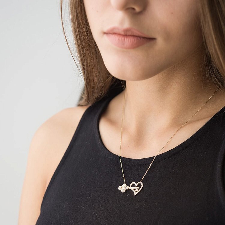 Золотое колье "Ключик и сердце" с фианитами кол00795 Золотое колье "Ключик и сердце" с фианитами кол00795 от ювелирного магазина Оникс