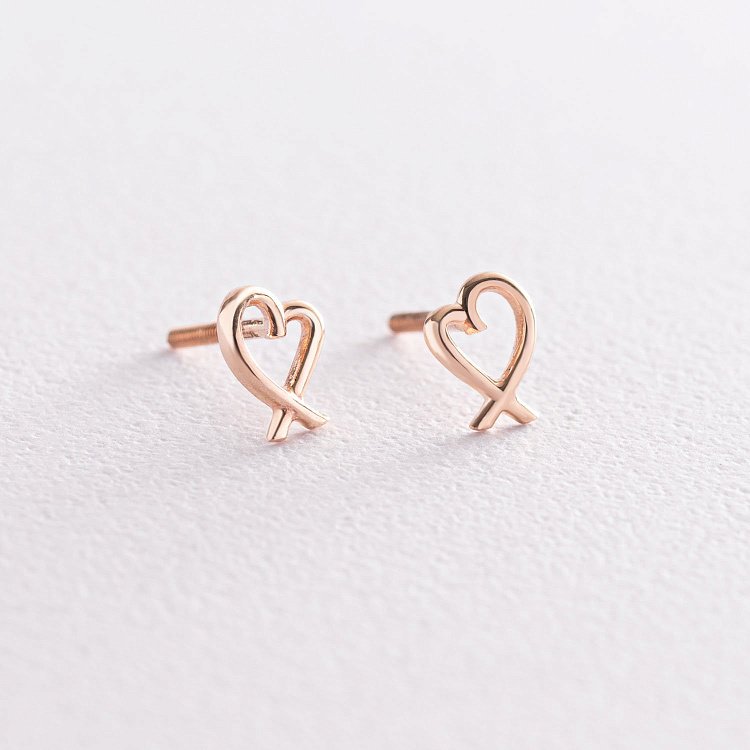 Сережки - пусети "Сердечка" в червоному золоті с07121 від ювелірного магазину Онікс