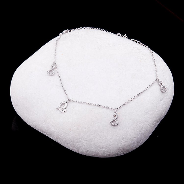 Срібний браслет на ногу "Нескінченність і серця" з фіанітами 14912 від ювелірного магазину Онікс - 1