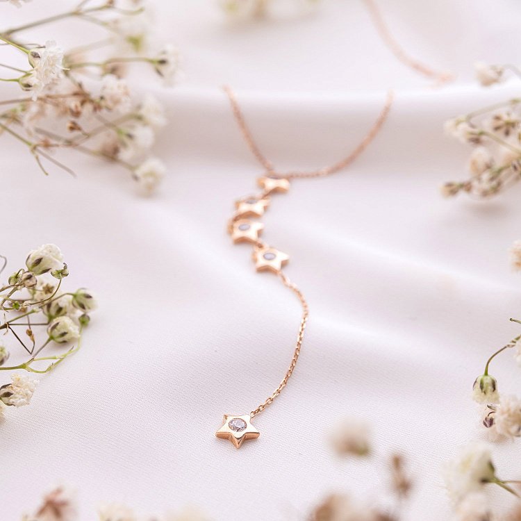 Золоте кольє "Зірочки" з фіанітами кол0149 від ювелірного магазину Онікс