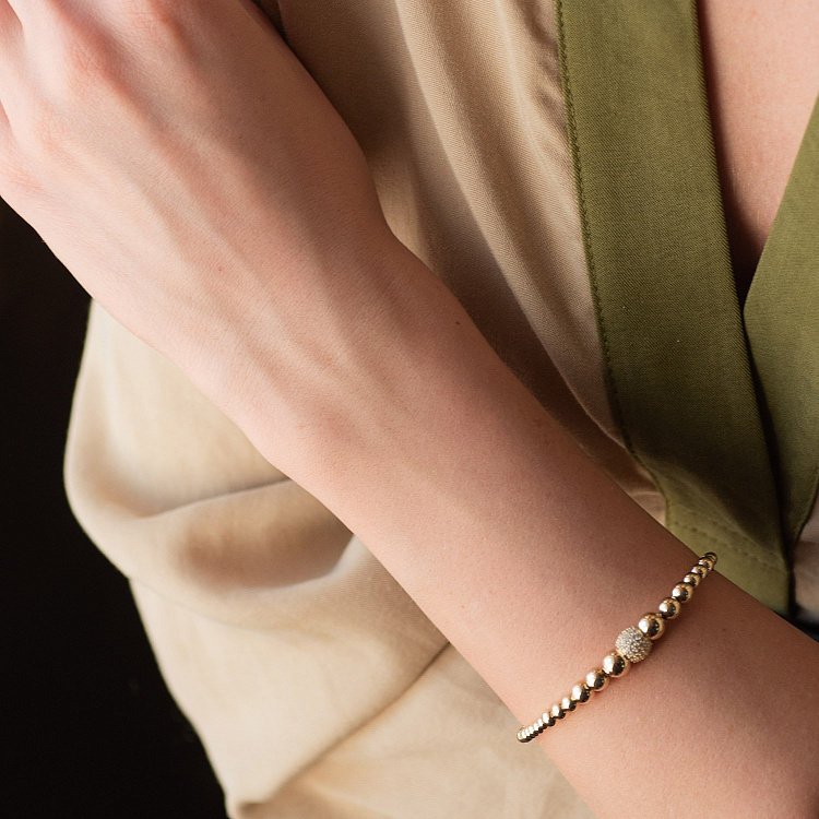 Браслет "Кульки" в жовтому золоті (фіаніти) б04652 від ювелірного магазину Онікс - 1