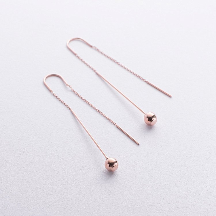 Золотые серьги "Шарики" на цепочке с08825 от ювелирного магазина Оникс