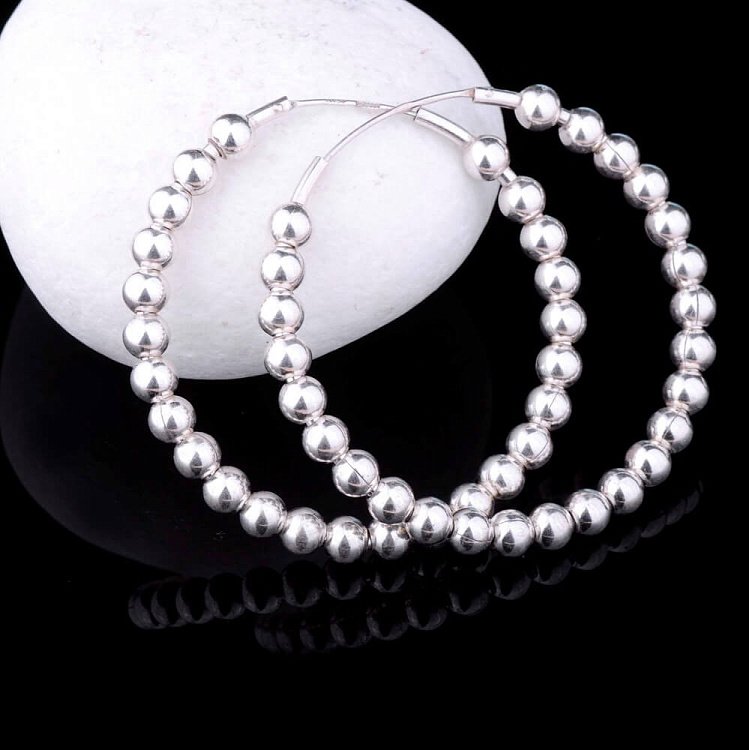 Сережки "Кільця" (40мм) 12540 від ювелірного магазину Онікс