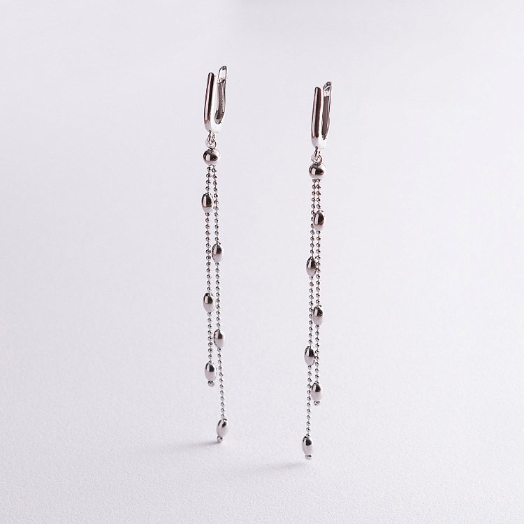 Срібні висячі сережки з кульками 123074 від ювелірного магазину Онікс