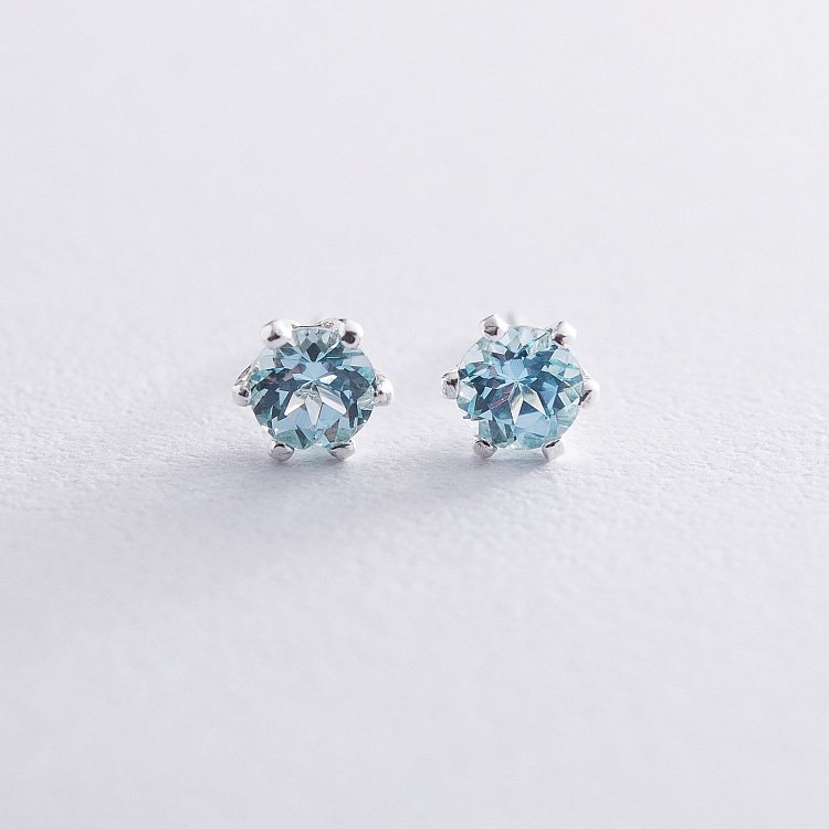 Серебряные серьги - гвоздики с синтетическим топазом 121980 от ювелирного магазина Оникс