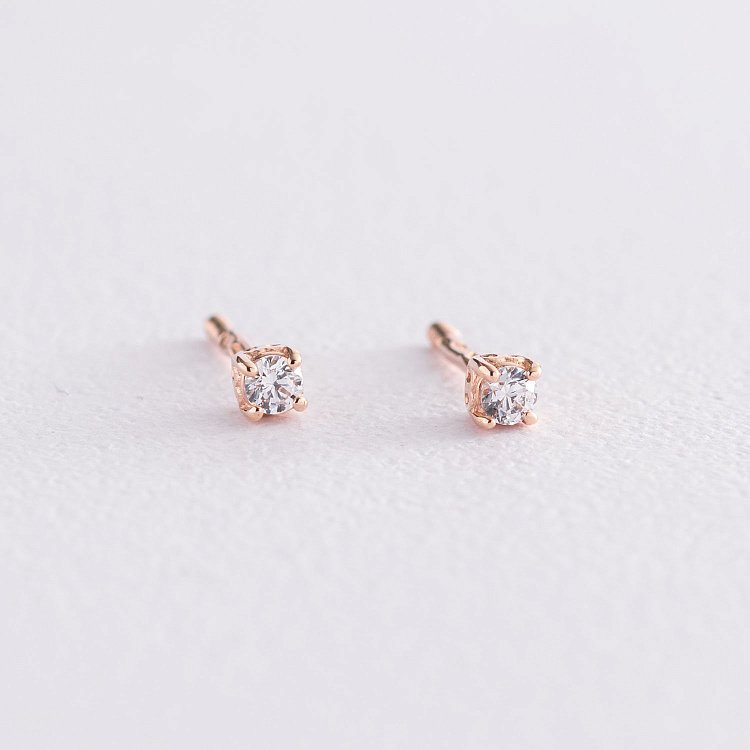 Золотые серьги-пусеты с фианитами 520279 от ювелирного магазина Оникс