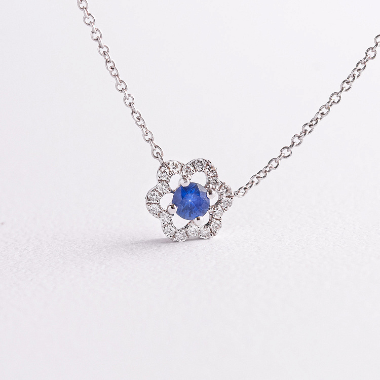 Золоте кольє "Квіточка" з діамантами та сапфіром колб0177ca від ювелірного магазину Онікс