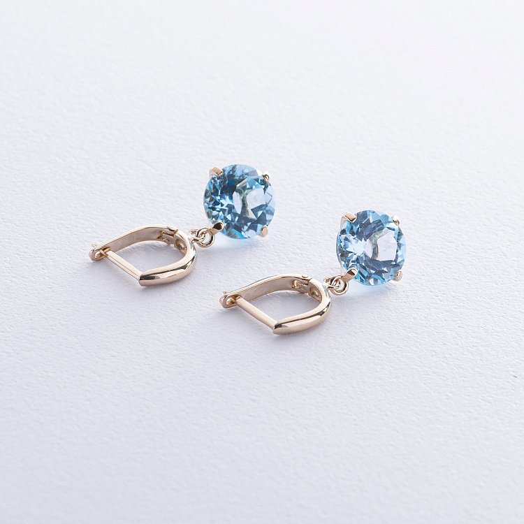 Золотые серьги "Влечение" с голубым топазом с08700 от ювелирного магазина Оникс - 2