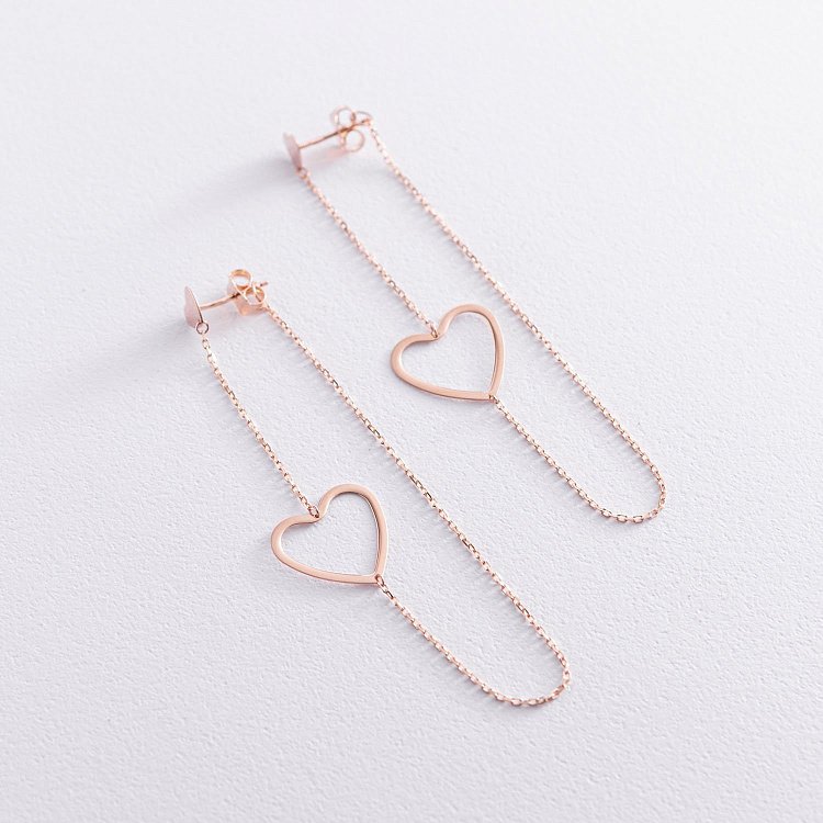 Золоті сережки - пусети на ланцюжку "Сердечка" с05957 від ювелірного магазину Онікс