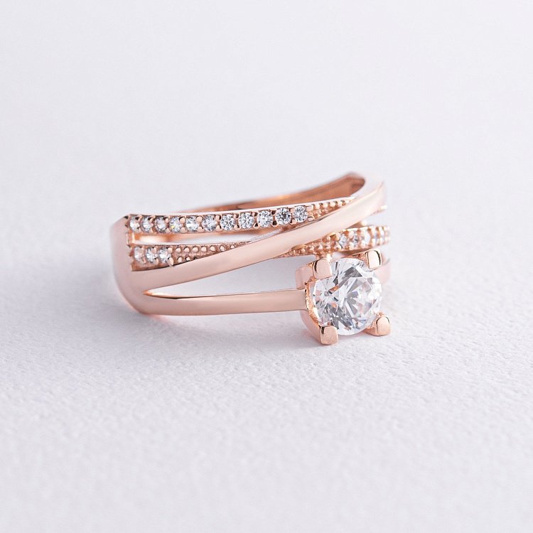 Золота каблучка з фіанітами к07021 Золота каблучка з фіанітами к07021 від ювелірного магазину Онікс