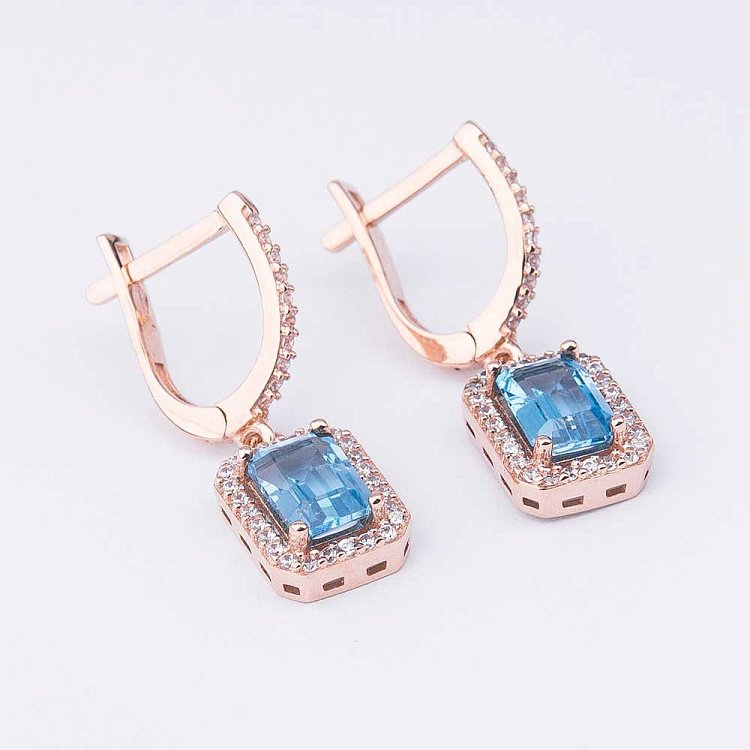 Золоті сережки з блакитним топазом і фіанітами с04175 від ювелірного магазину Онікс - 1