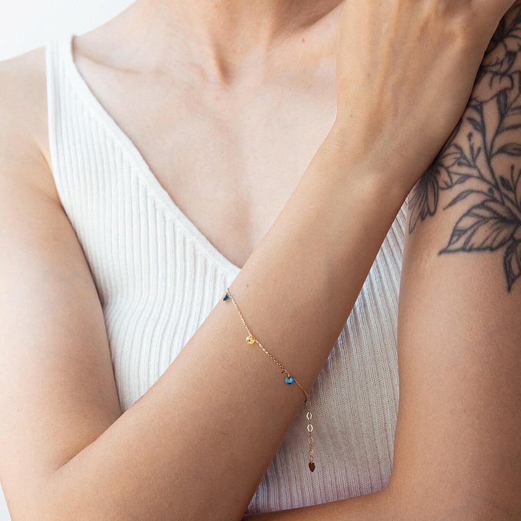 Золотий браслет "Українка" (сині та жовті фіаніти) б05116 від ювелірного магазину Онікс - 1