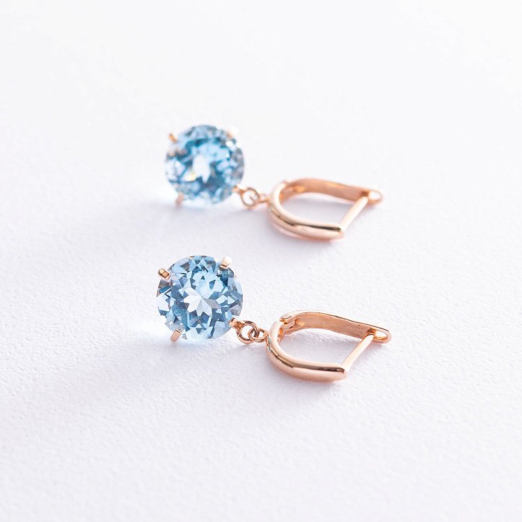 ﻿Золоті сережки "Захоплення" з блакитним топазом с05295 від ювелірного магазину Онікс - 3