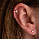 Одиночная золотая серьга для хеликса "Крестик" (фианиты) з40102ч от ювелирного магазина Оникс