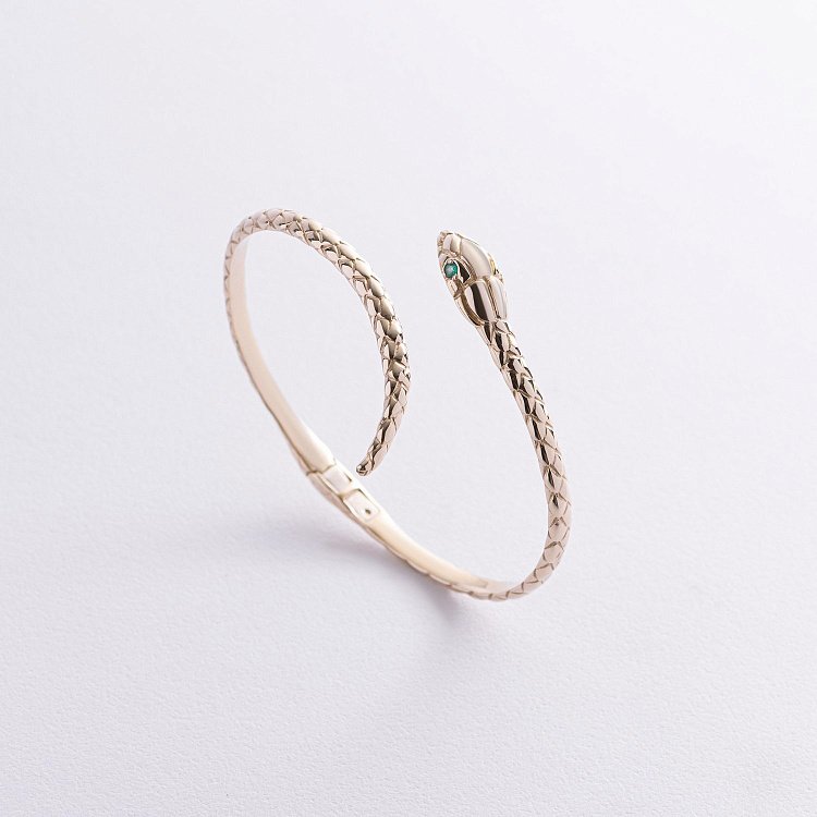 Жорсткий браслет "Змія" у жовтому золоті (смарагди) бб0044м від ювелірного магазину Онікс