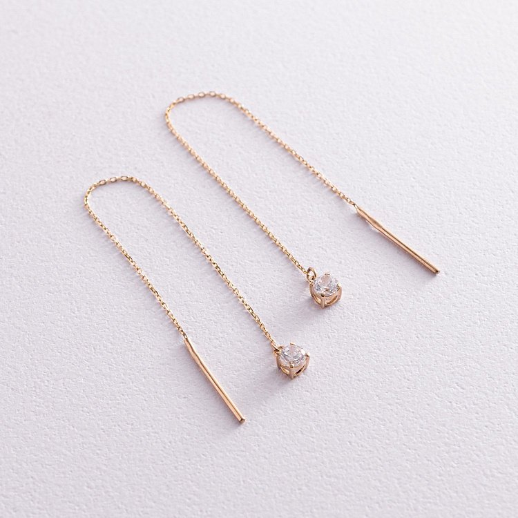 Золоті сережки - протяжки з фіанітами с07658 від ювелірного магазину Онікс