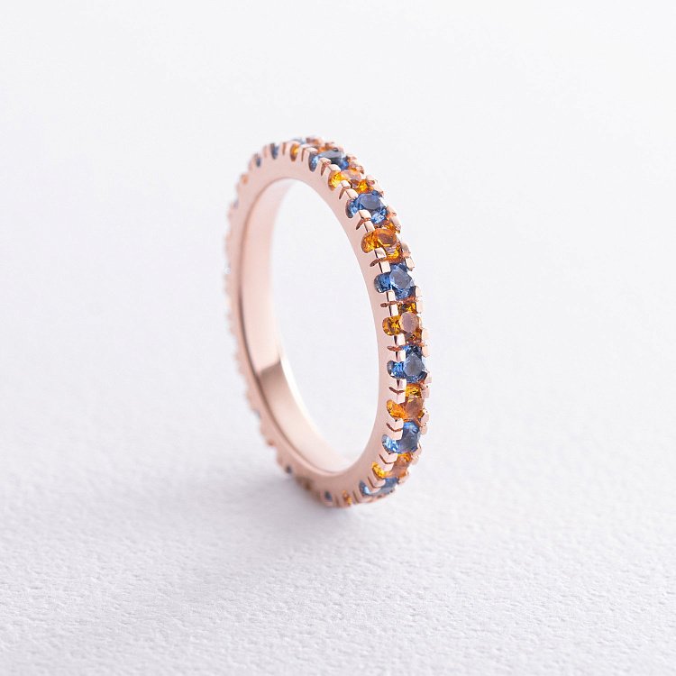 Кольцо с дорожкой голубых и желтых камней (красное золото) 815к от ювелирного магазина Оникс