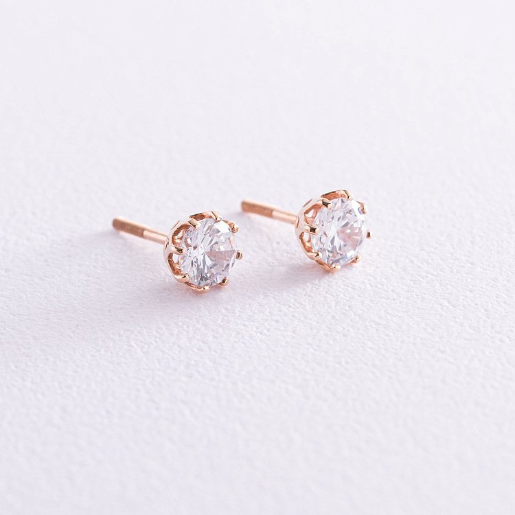 Золотые серьги-гвоздики с фианитами с05185 от ювелирного магазина Оникс