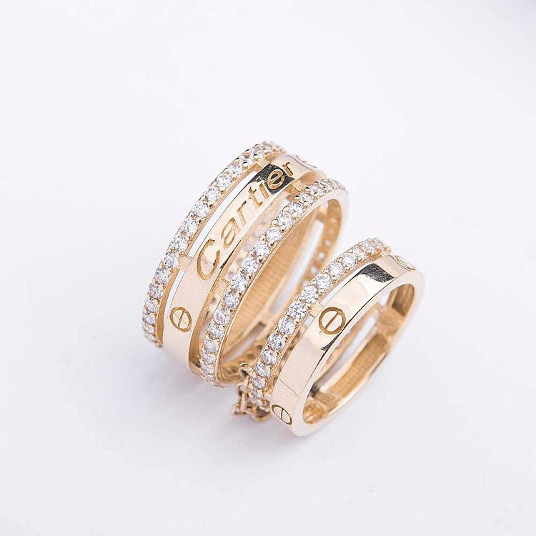 Подвійна золота каблучка з фіанітами к03358 від ювелірного магазину Онікс