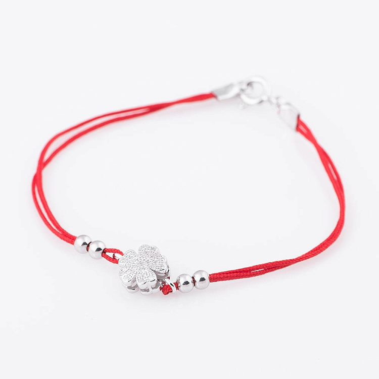 Браслет з червоною никою і квіточкою 141158 від ювелірного магазину Онікс