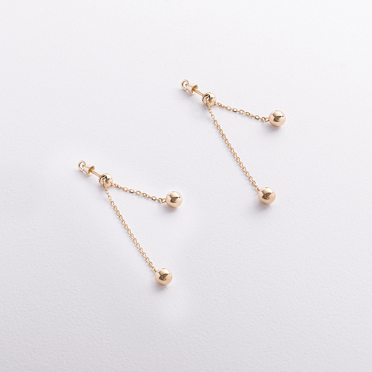 Серьги - пусеты с шариками на цепочке (желтое золото) 580142м от ювелирного магазина Оникс