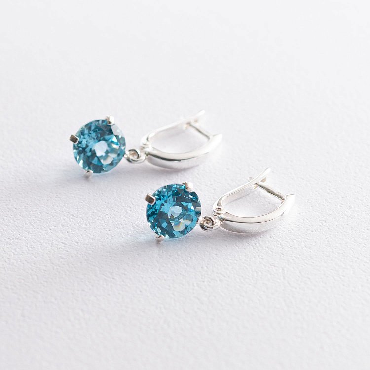 Срібні сережки "Захоплення" (шт. топаз) 122857 від ювелірного магазину Онікс