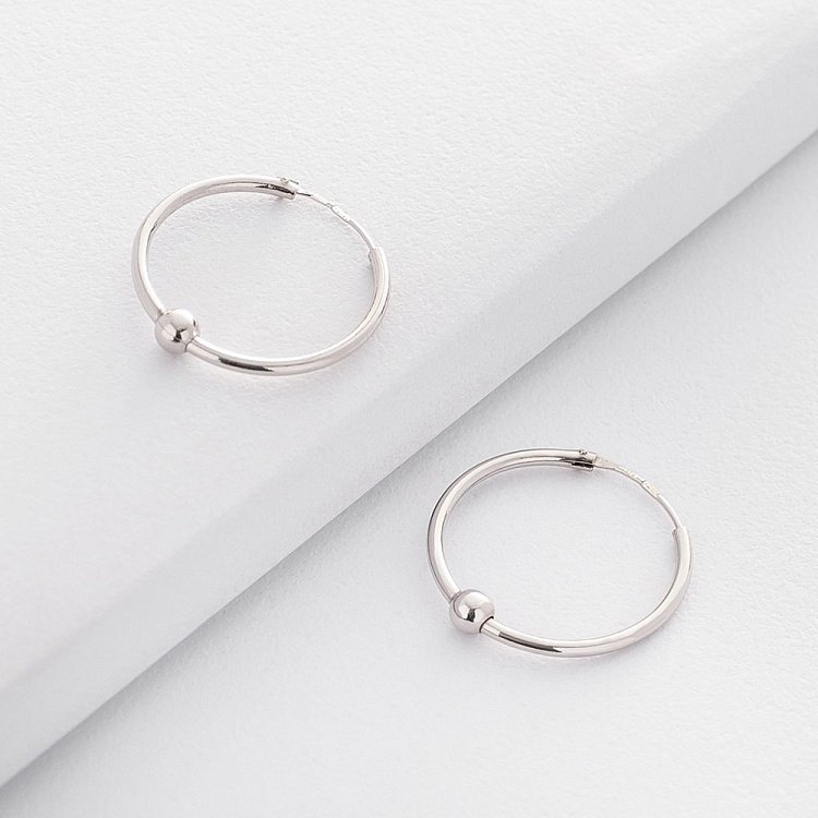 Срібні сережки-кільця 122439 від ювелірного магазину Онікс