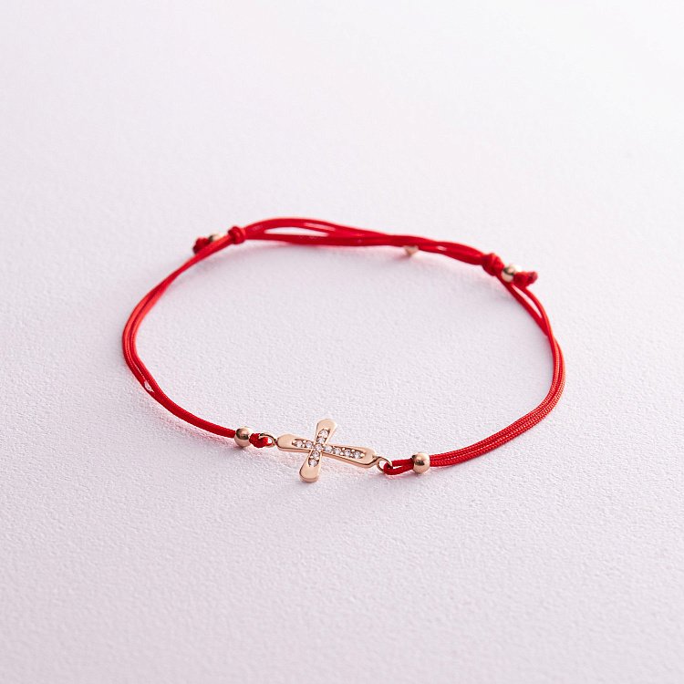 Золотий браслет "Хрестик" з червоною ниткою (фіаніти) б05139 Золотий браслет "Хрестик" з червоною ниткою (фіаніти) б05139 від ювелірного магазину Онікс