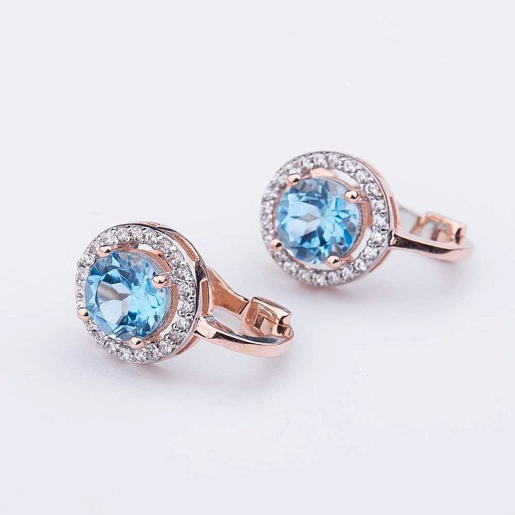 Золоті сережки з блакитним топазом і фіанітами с04165 від ювелірного магазину Онікс - 1