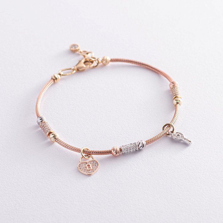 Золотий браслет "Сердечко з ключиком" (фіаніт) б04008 від ювелірного магазину Онікс