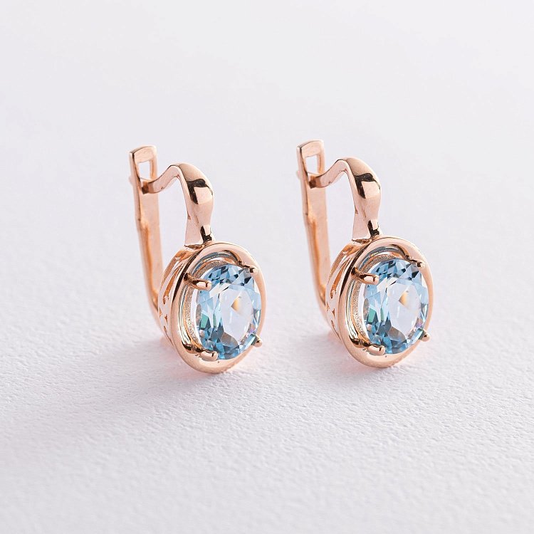 Золотые серьги с голубыми топазами с05463 от ювелирного магазина Оникс